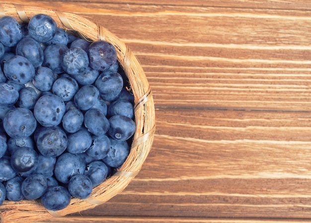 Top view of a basket with blueberries