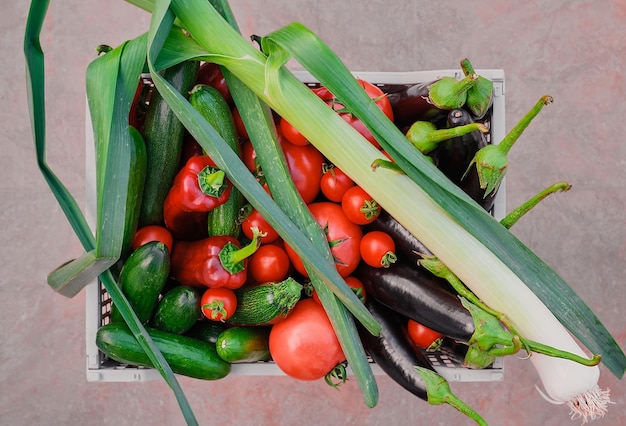 Top view of a basket with fresh seasonal vegetables from the farmer's market fresh natural seasonal products with delivery for a healthy and varied diet the basis of a fulfilling life