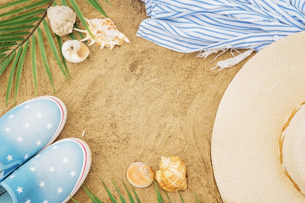 Top view of beach accessories on the sand