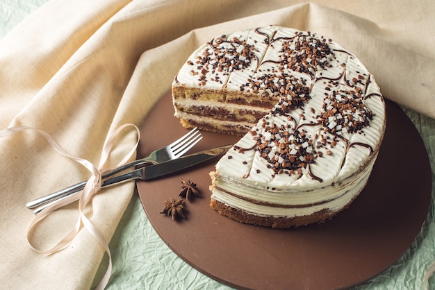 Top view of beautiful homemade layered sponge cake with white cream