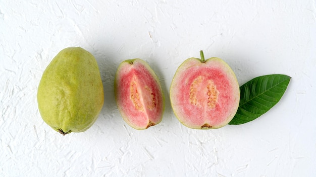 Top view of beautiful red guava with fresh green leaves