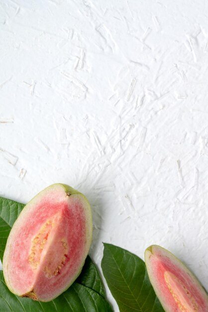 Top view of beautiful red guava with fresh green leaves