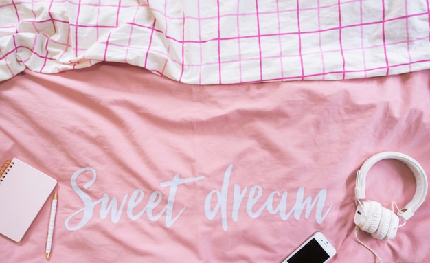 Photo top view of bedding sheets pink minimal style.