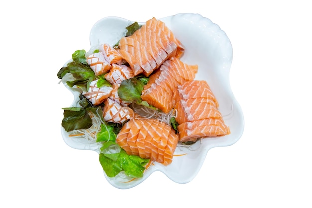 Photo top view of big set fresh salmon and sashimi with green oak lettuce shredded radishes focus selective