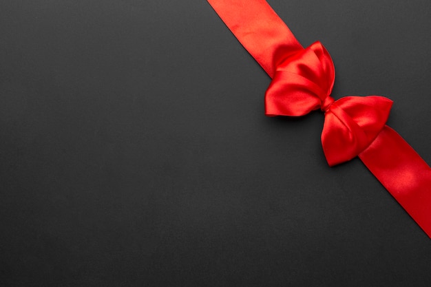 Top view black friday red ribbon with copy space