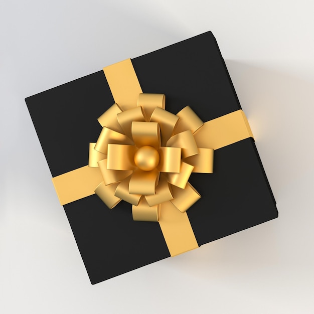 Top view of black gift box with gold ribbon and bow isolated on white background.