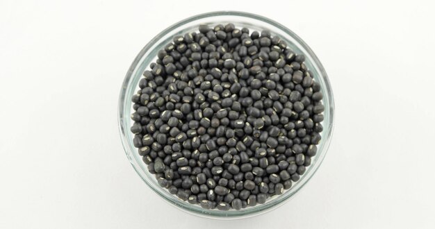 Top view of black lentils in a glass container