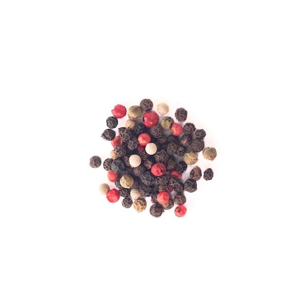 Top view of black white green and pink peppercorns isolated on white background