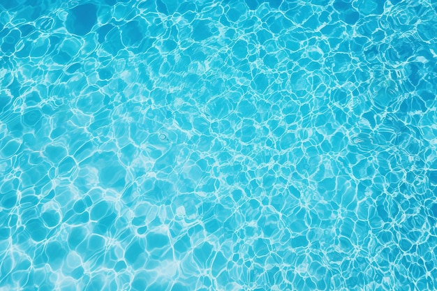 Top view of the blue water texture in the swimming pool background