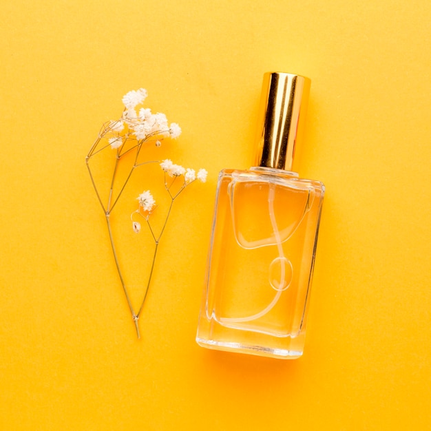 Top view bottle with perfume on the table