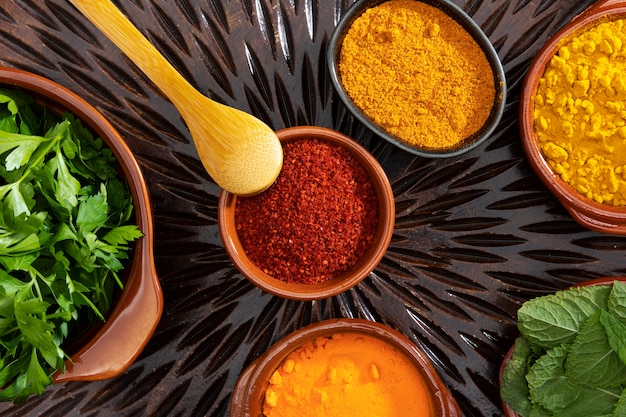 Photo top view bowls with spices and herbs