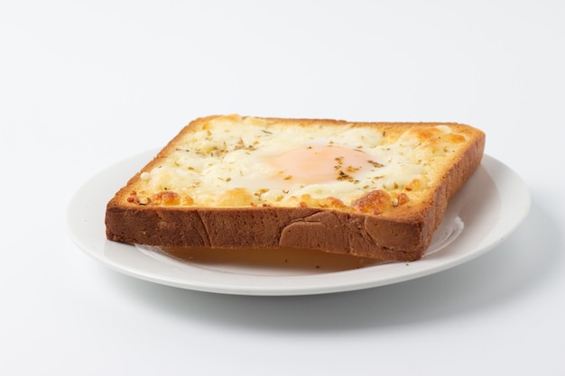 Top view of breakfast with fried egg on toast, isolated on white