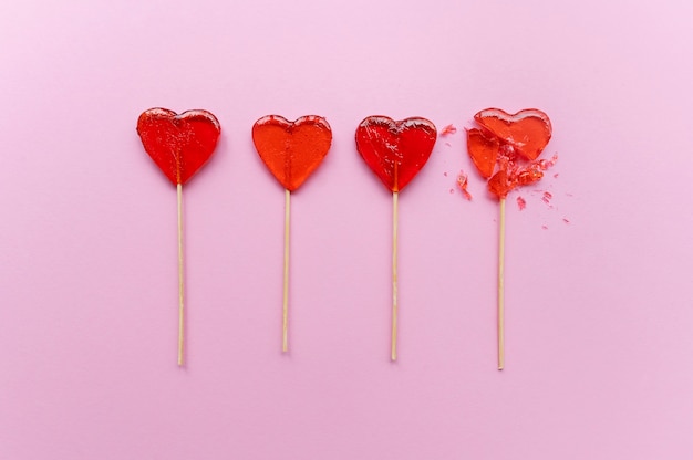 Photo top view of broken heart candy treat on stick