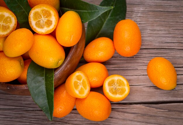 Top view of bunch of fresh kumquats in the organic food market.