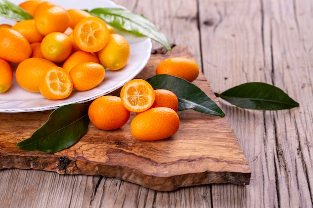 Top view of bunch of fresh kumquats in the organic food market.