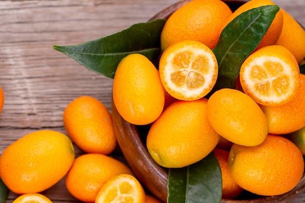 Top view of bunch of fresh kumquats in the organic food market.