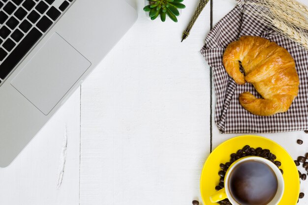 top view business breakfast with coffee and croissant