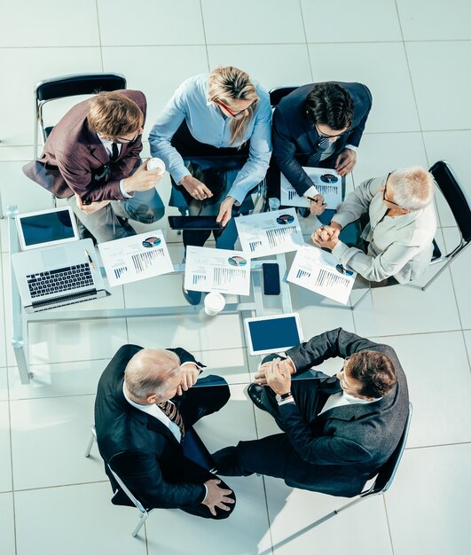 Top view. business colleagues discussing financial data at an office meeting. business concept.