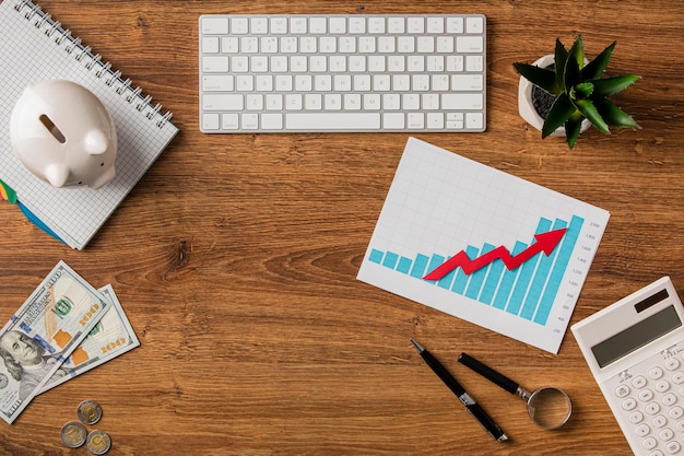 Photo top view of business items and growth chart