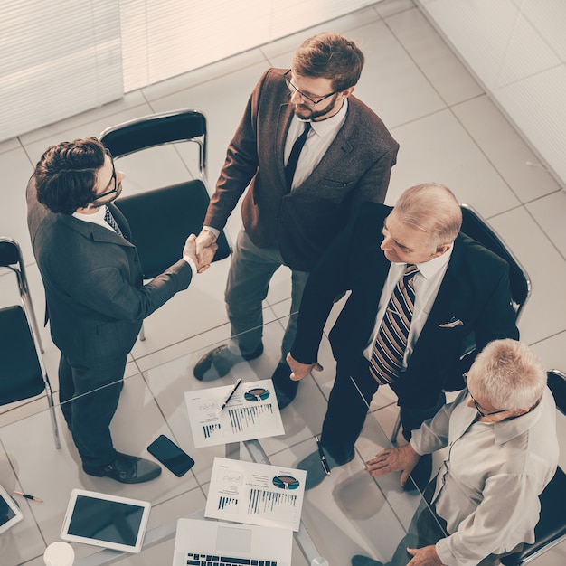 Top view business people greeting each other before the meeting