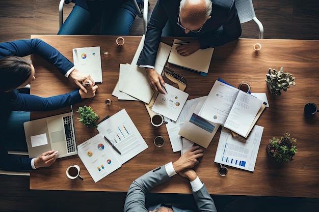 Top view of business people sitting at table and discussing something while working in office Business meeting on a working table top view No visible faces AI Generated