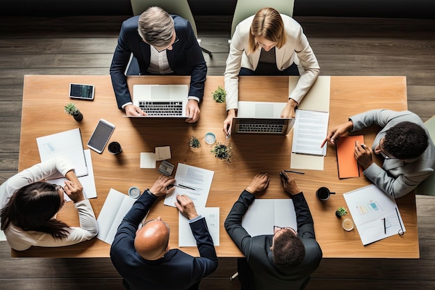 Top view of business people sitting at table and working together in office Business meeting on a working table top view No visible faces AI Generated