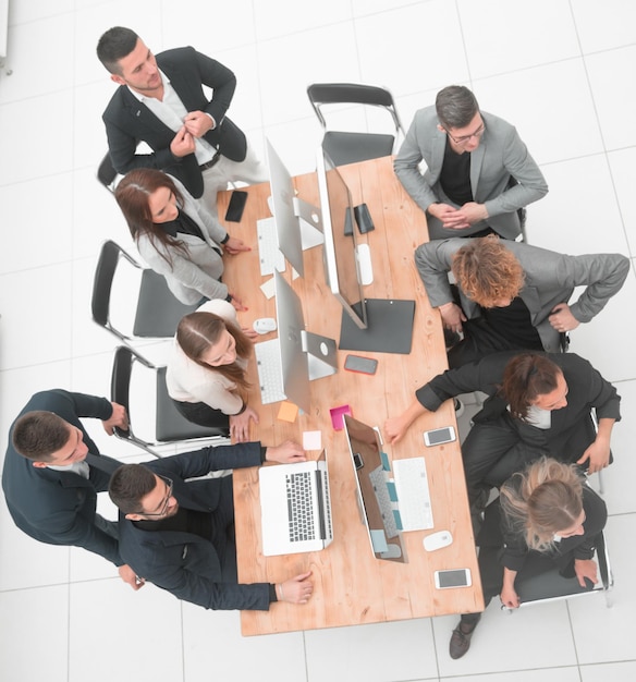 Top view business team sitting at the desk