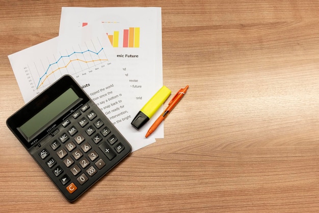 Top view calculator and paperwork on table with copy space