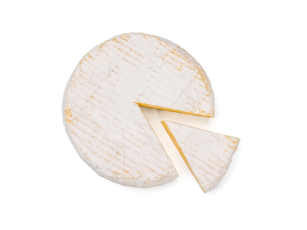 Photo top view of camembert cheese with a cut piece isolated on a white background.