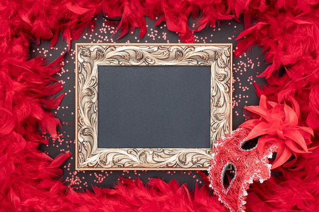 Photo top view of carnival mask with frame and feathers