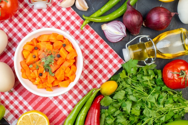 top view carrot salad with fresh vegetables and greens on dark background food health dough meal color diet snack salad