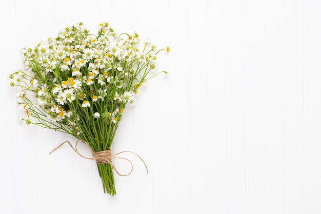 Top view of chamomile flowers bouquet