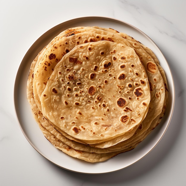 Photo a top view of chapati with white background