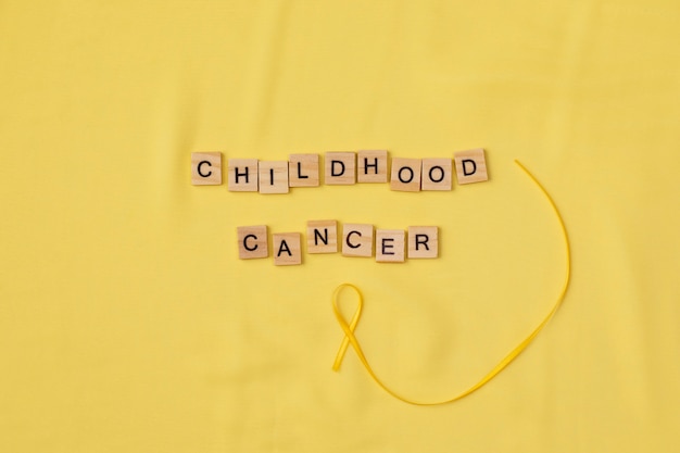 Photo top view over childhood cancer awareness month background concepttoys,