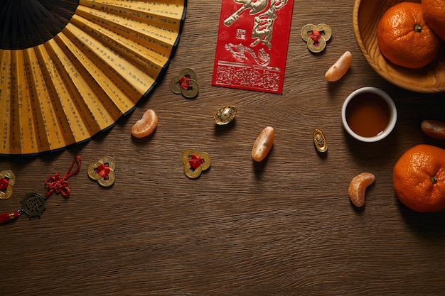 Top view of chinese new year composition on wooden surface