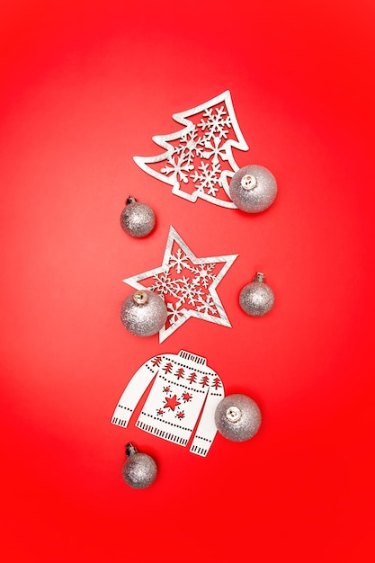 Top view of Christmas decoration toys on red background