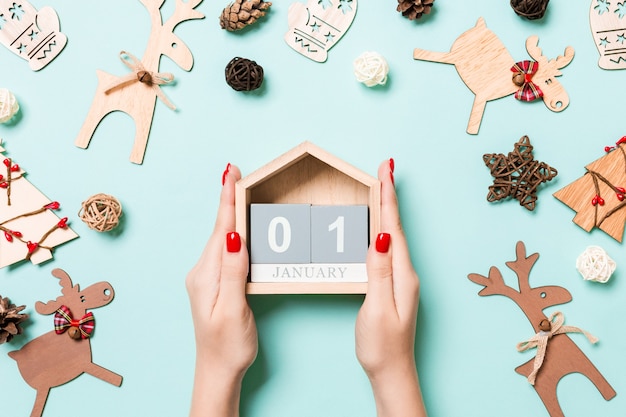 Top view christmas decorations with wooden calendar