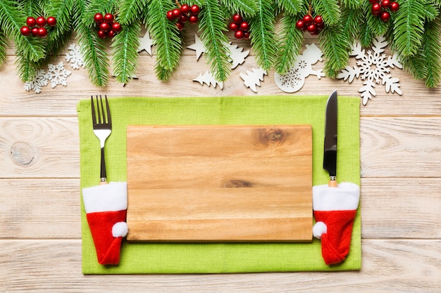 Top view of Christmas dinner on wooden background