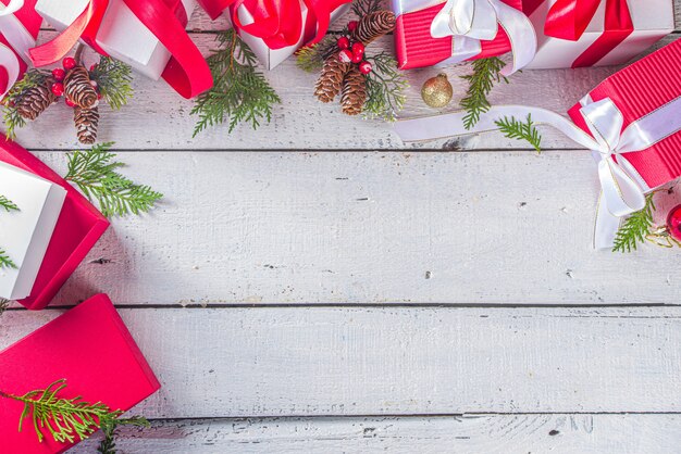 Top view of Christmas gift boxes with festive ribbons