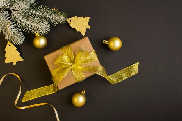 Top view of Christmas gift with gold bow