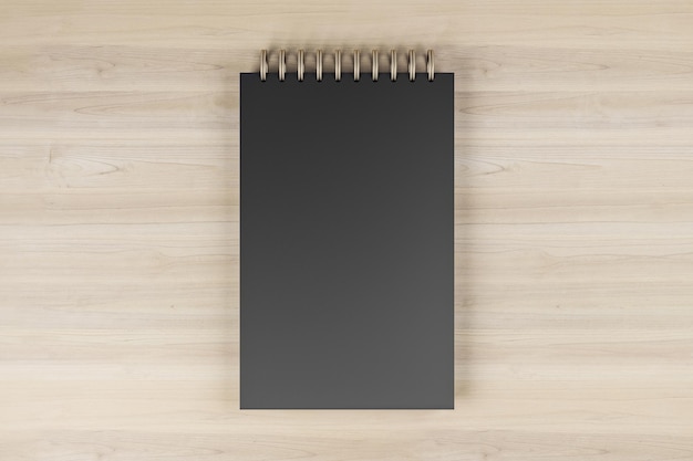 Top view and close up of black spring note pad on wooden desktop background Mock up place for your advertisement Education work supplies and stationery concept 3D Rendering