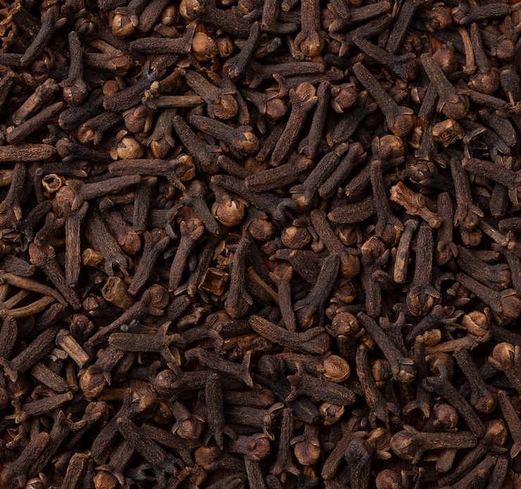 Photo top view, closeup of cloves. food backdrop.