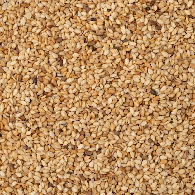 Top view, closeup of sesame seeds. Food backdrop.