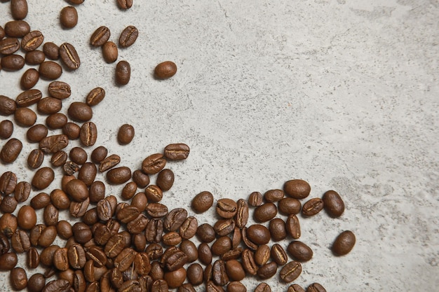 Top view of coffee beans on cement floor copy space