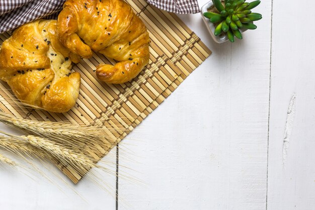 top view coffee and croissant with coffee bean