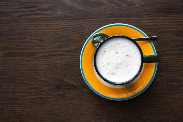 Top view of coffee cup on table