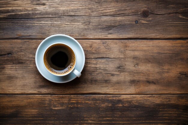 Top view of a coffee cup on a wooden table