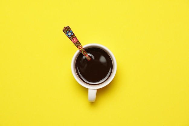 Top view of coffee on a yellow background. flat lay flat design