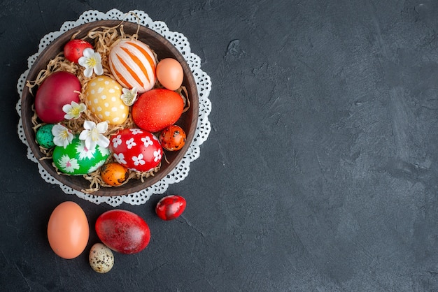 top view colored designed eggs inside brown plate dark background spring holiday colourful novruz ornate horizontal