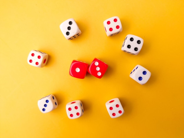 Top view Colored dice on a yellow background